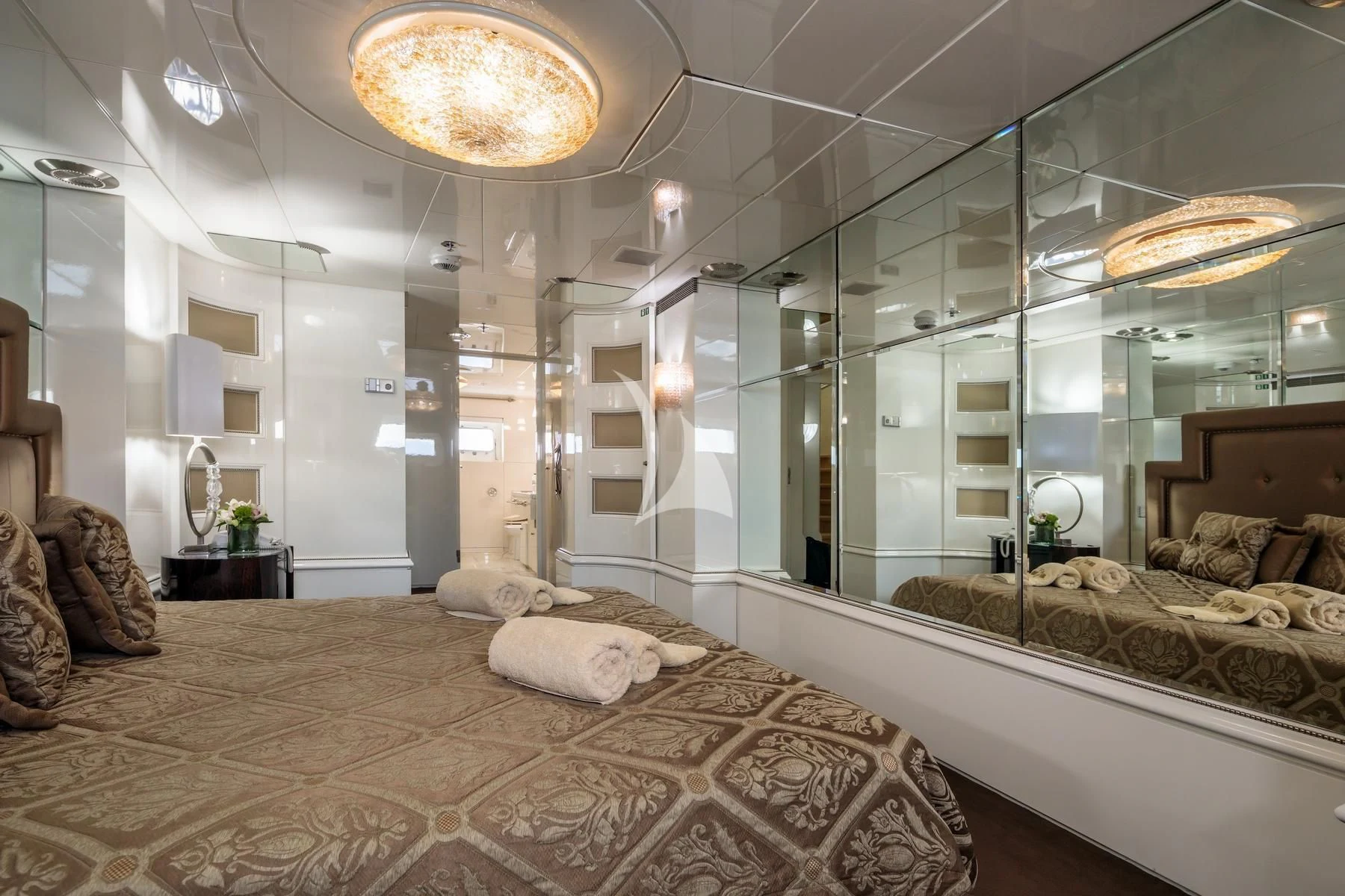 a large room with a bed and a couch aboard VERA Yacht for Sale