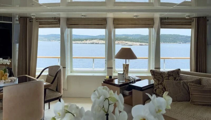 a living room with a large window aboard VERA Yacht for Sale