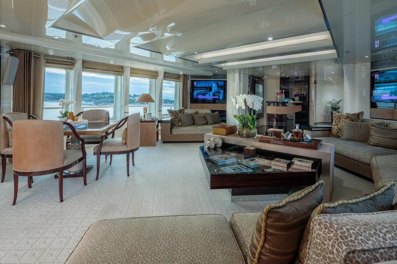 a living room with a large window aboard VERA Yacht for Sale