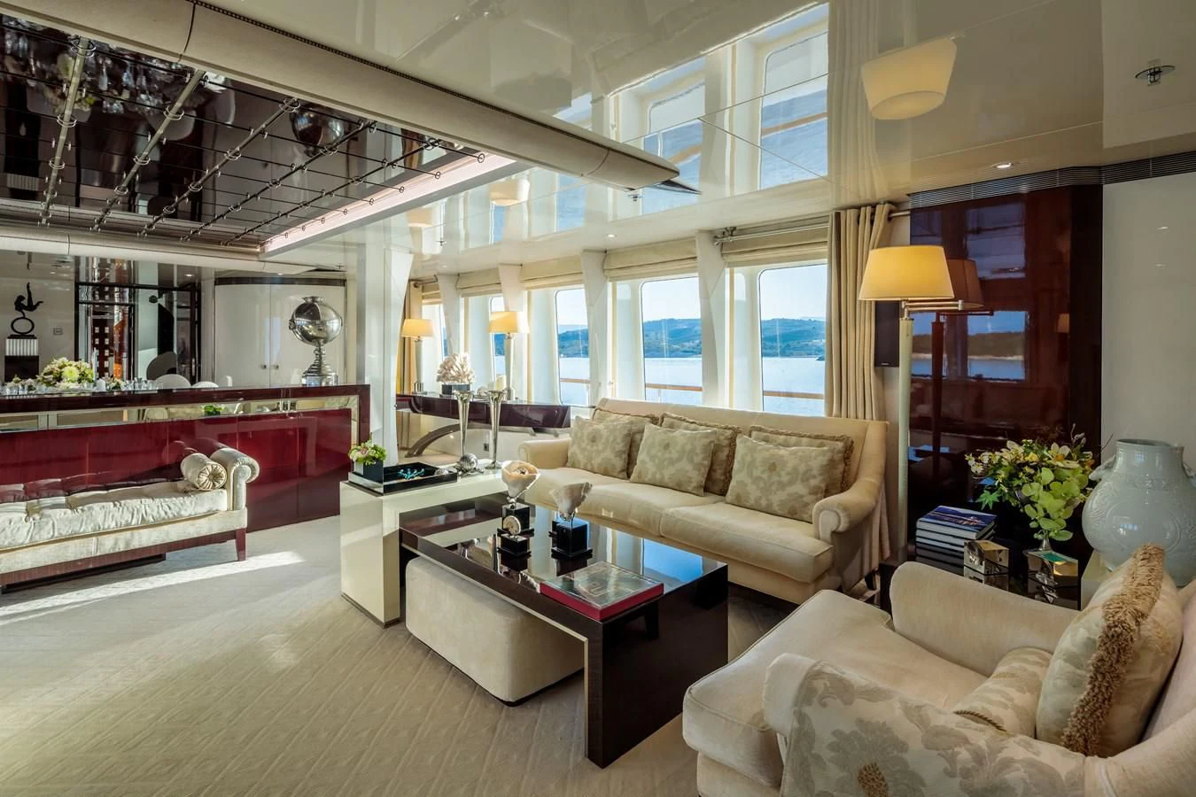a living room with a bed and a piano aboard VERA Yacht for Sale