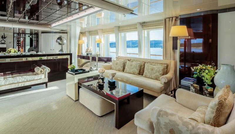 a living room with a couch and a coffee table aboard VERA Yacht for Sale