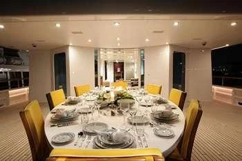 a table set for a dinner aboard VERA Yacht for Sale