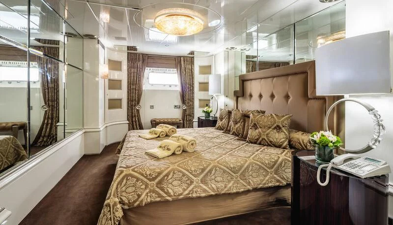 a large bed in a room aboard VERA Yacht for Sale