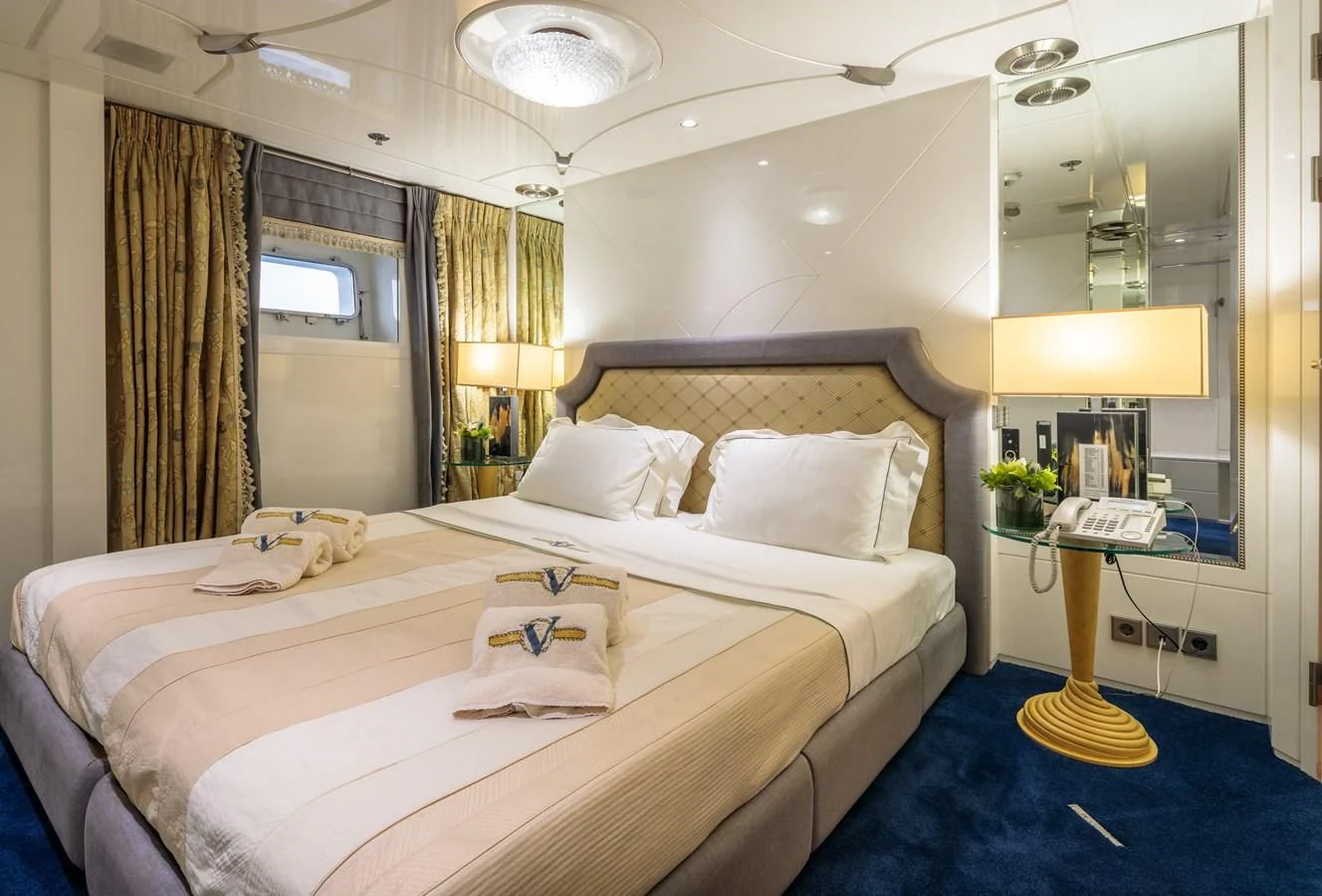 a couple of beds in a hotel room aboard VERA Yacht for Sale