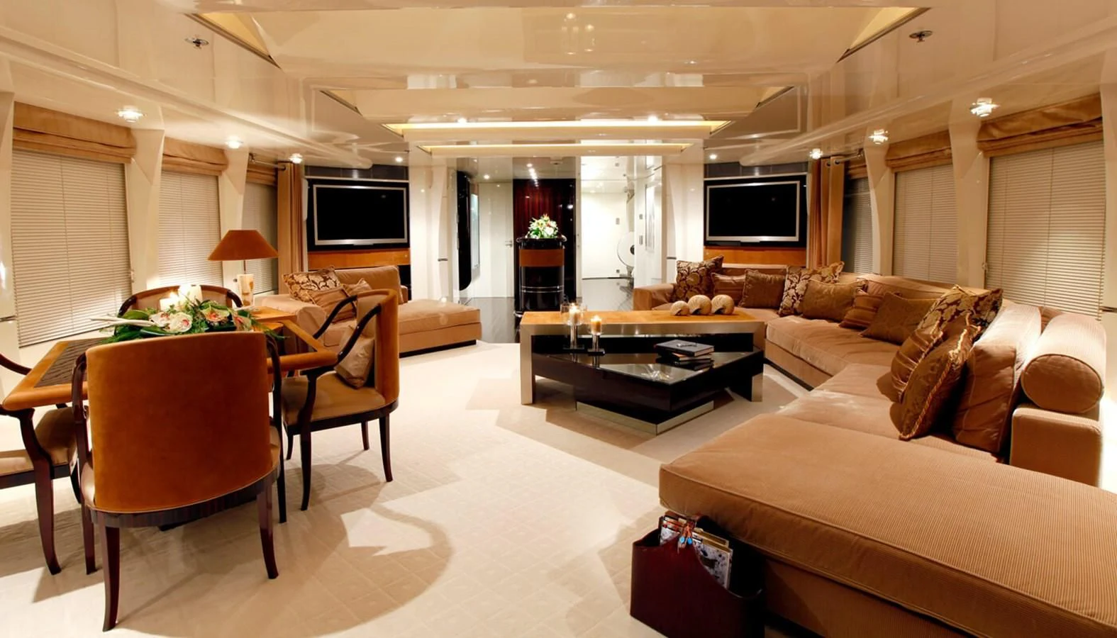 a living room with a couch and a television aboard VERA Yacht for Sale