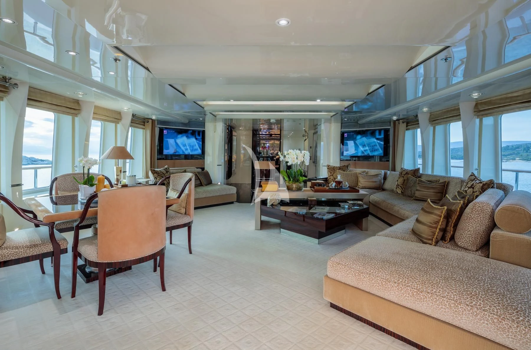 a living room with a couch and a television aboard VERA Yacht for Sale