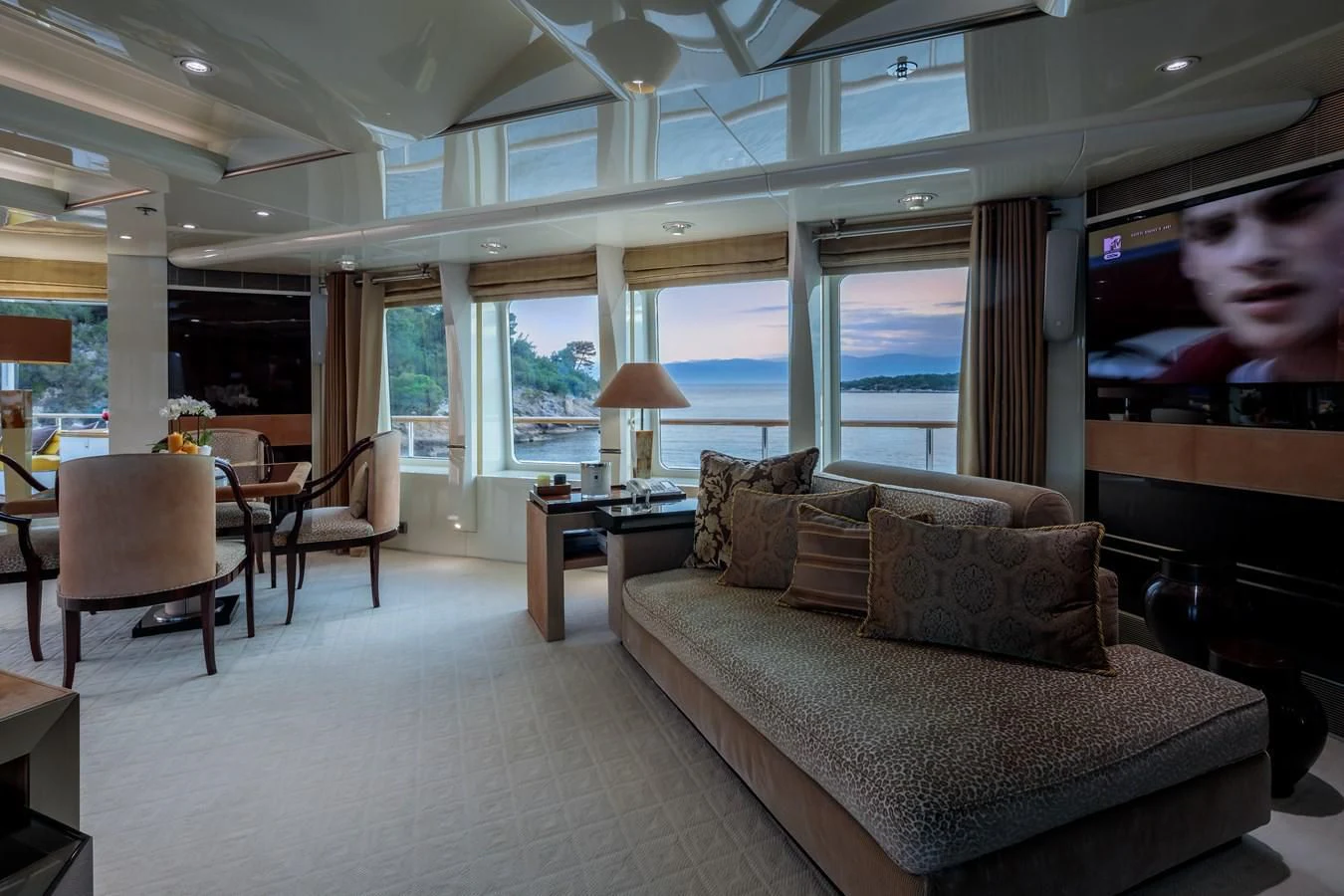 a living room with a large screen aboard VERA Yacht for Sale