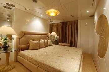 a bed with a white sheet aboard VERA Yacht for Sale