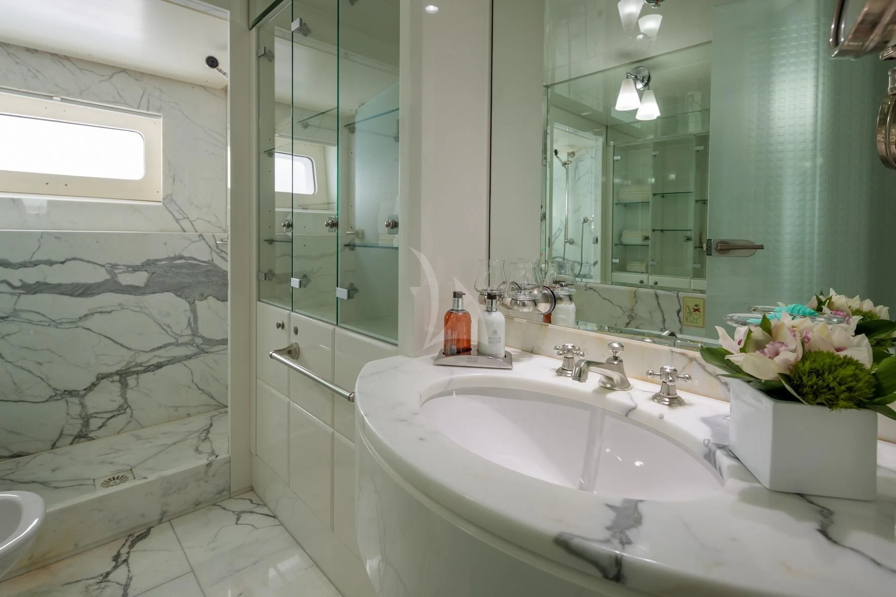 a bathroom with a large mirror aboard VERA Yacht for Sale