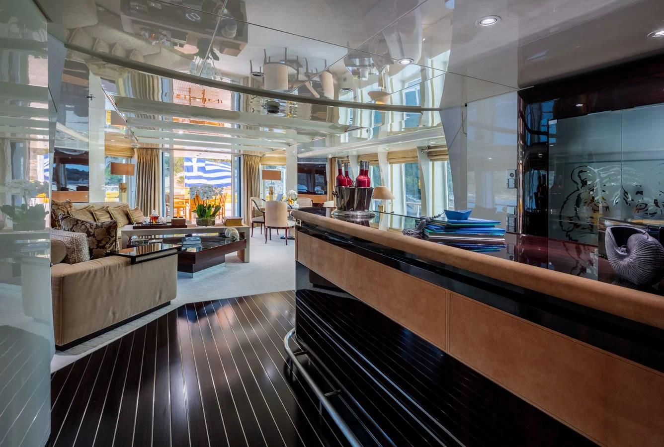 a large room with a wood floor aboard VERA Yacht for Sale