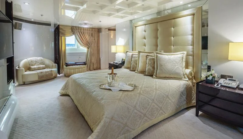 a large bed in a hotel room aboard VERA Yacht for Sale