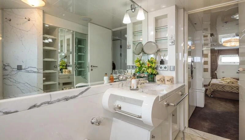 a bathroom with a large mirror aboard VERA Yacht for Sale