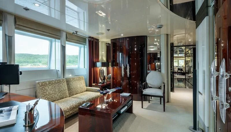 a living room with a couch and a table aboard VERA Yacht for Sale