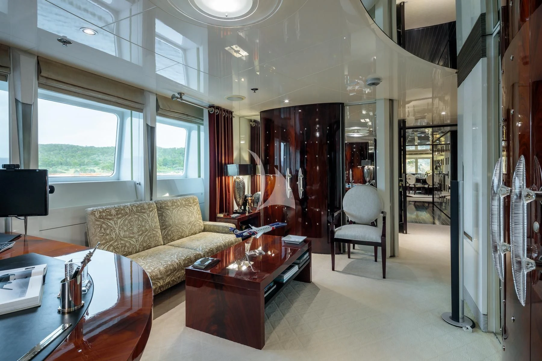 a living room with a couch and a table aboard VERA Yacht for Sale