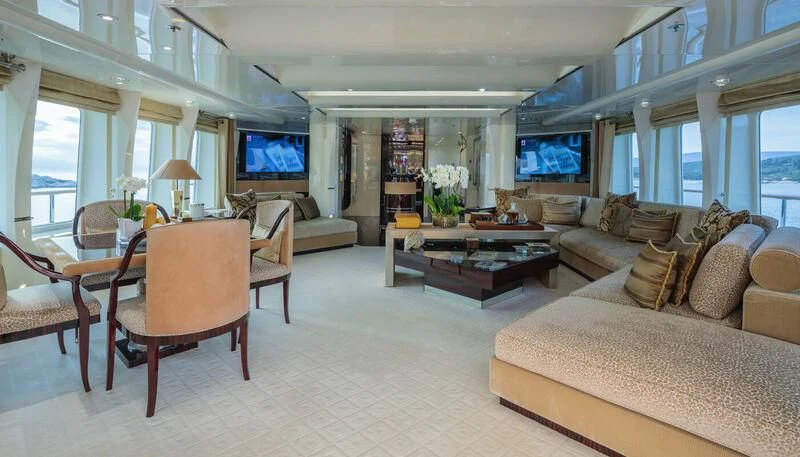 a living room with a couch and a tv aboard VERA Yacht for Sale