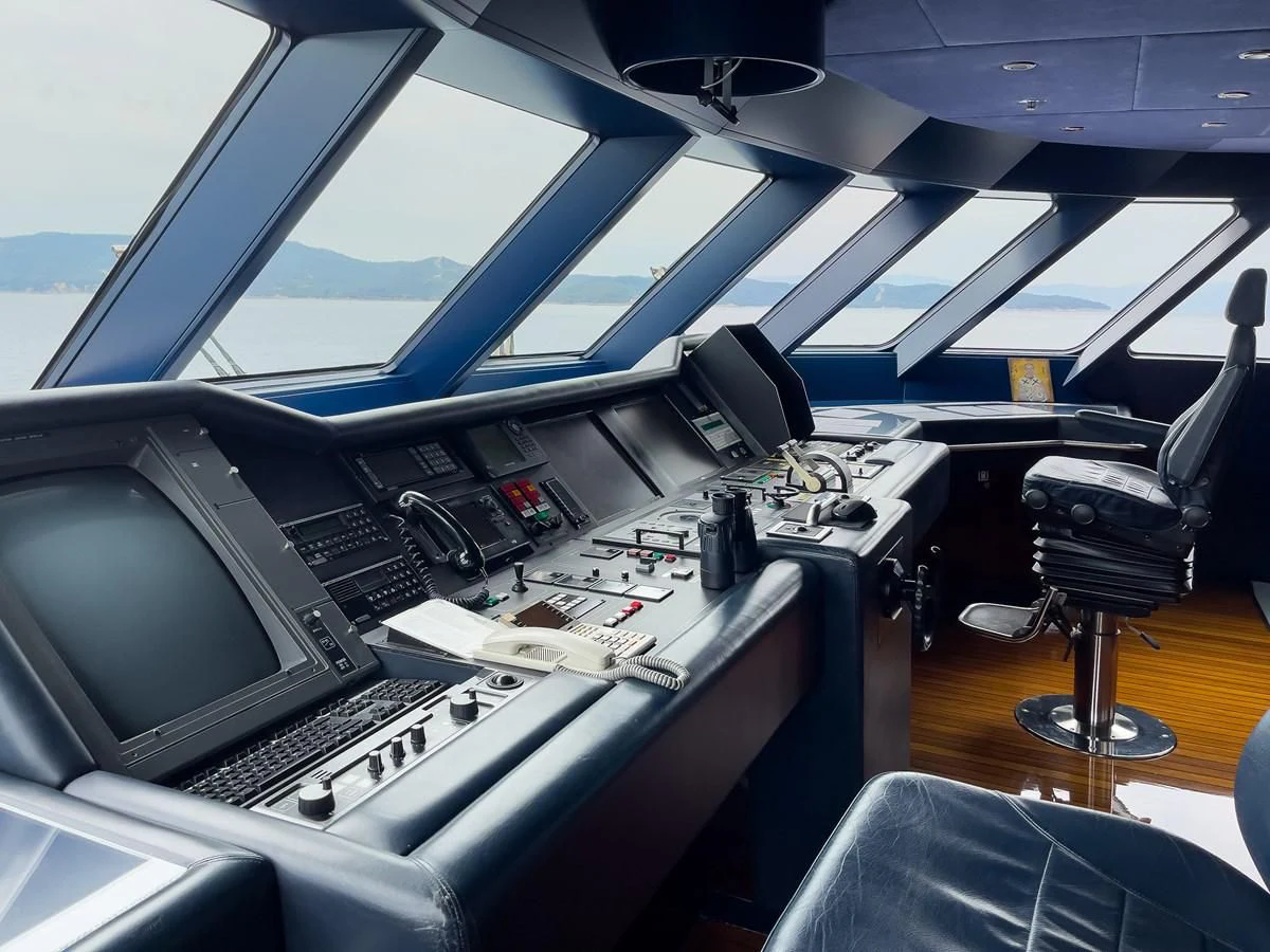 a cockpit with a laptop and other electronics aboard VERA Yacht for Sale