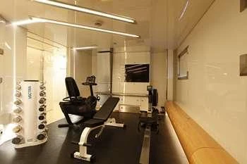 a room with a desk and chairs aboard VERA Yacht for Sale