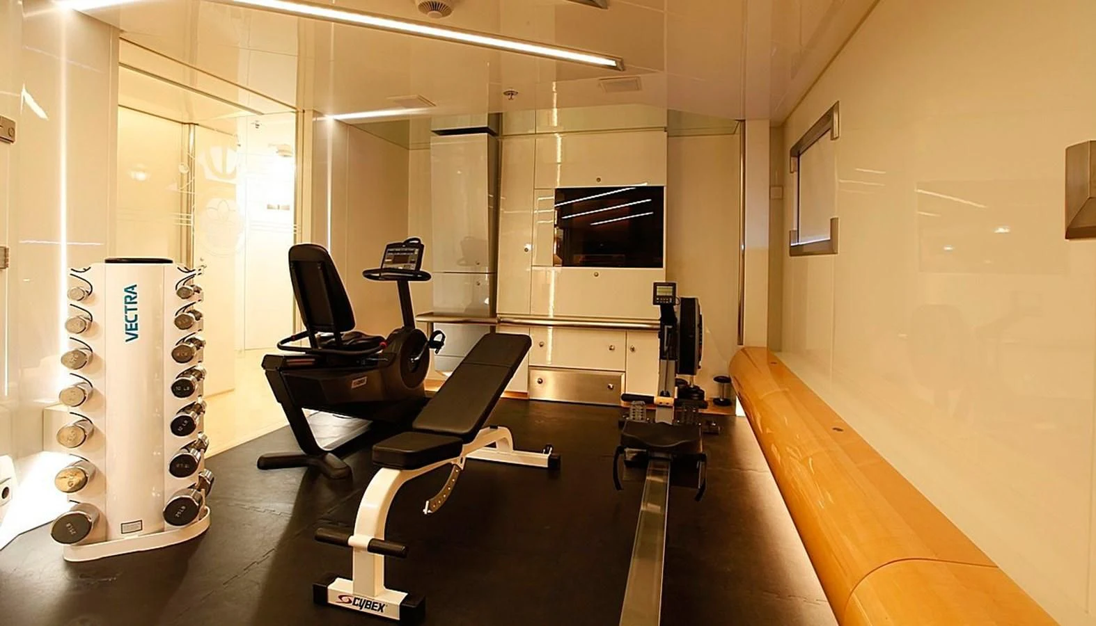 a room with a desk and a tv aboard VERA Yacht for Sale