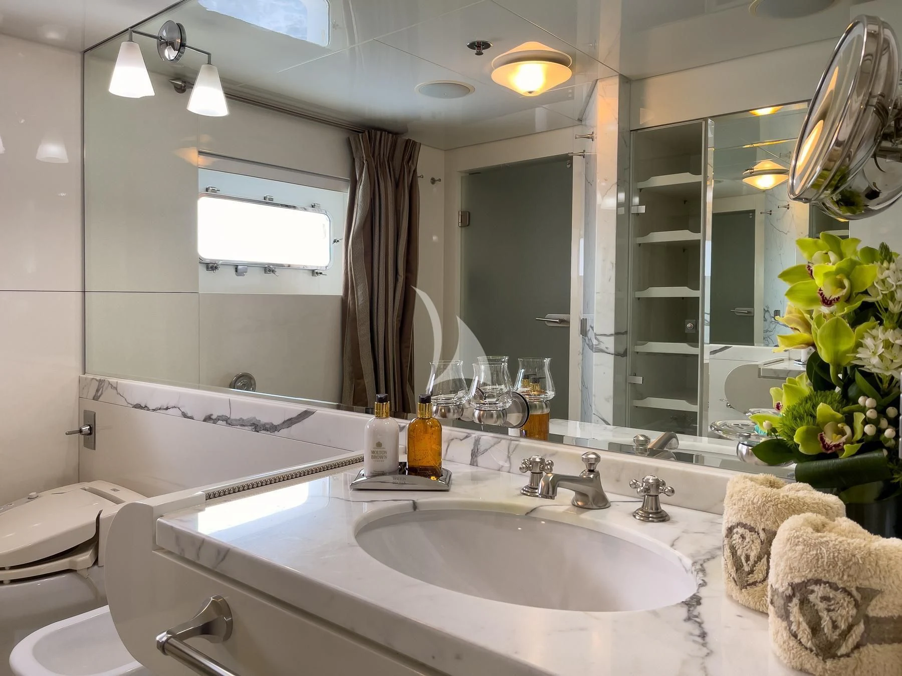 a bathroom with a large mirror aboard VERA Yacht for Sale
