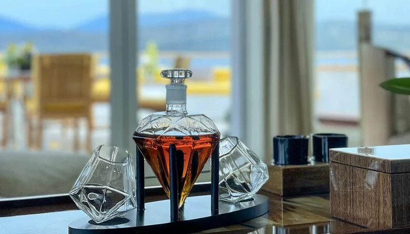 a glass of liquid on a table aboard VERA Yacht for Sale