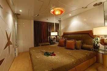 a bed with a large bed aboard VERA Yacht for Sale