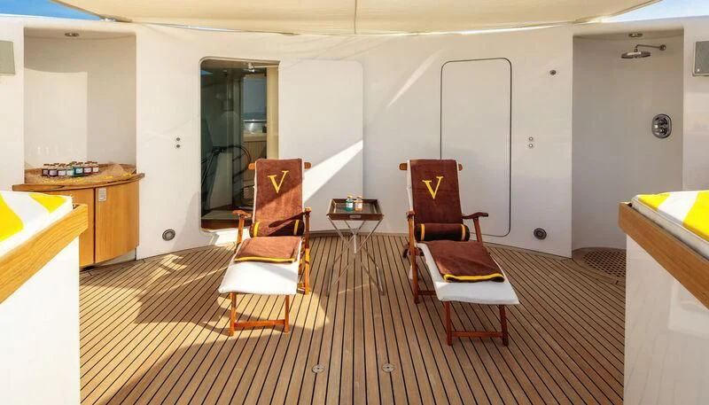 a room with chairs and a table aboard VERA Yacht for Sale