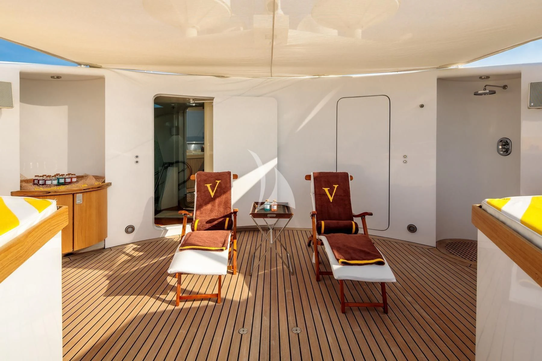 a room with chairs and a table aboard VERA Yacht for Sale
