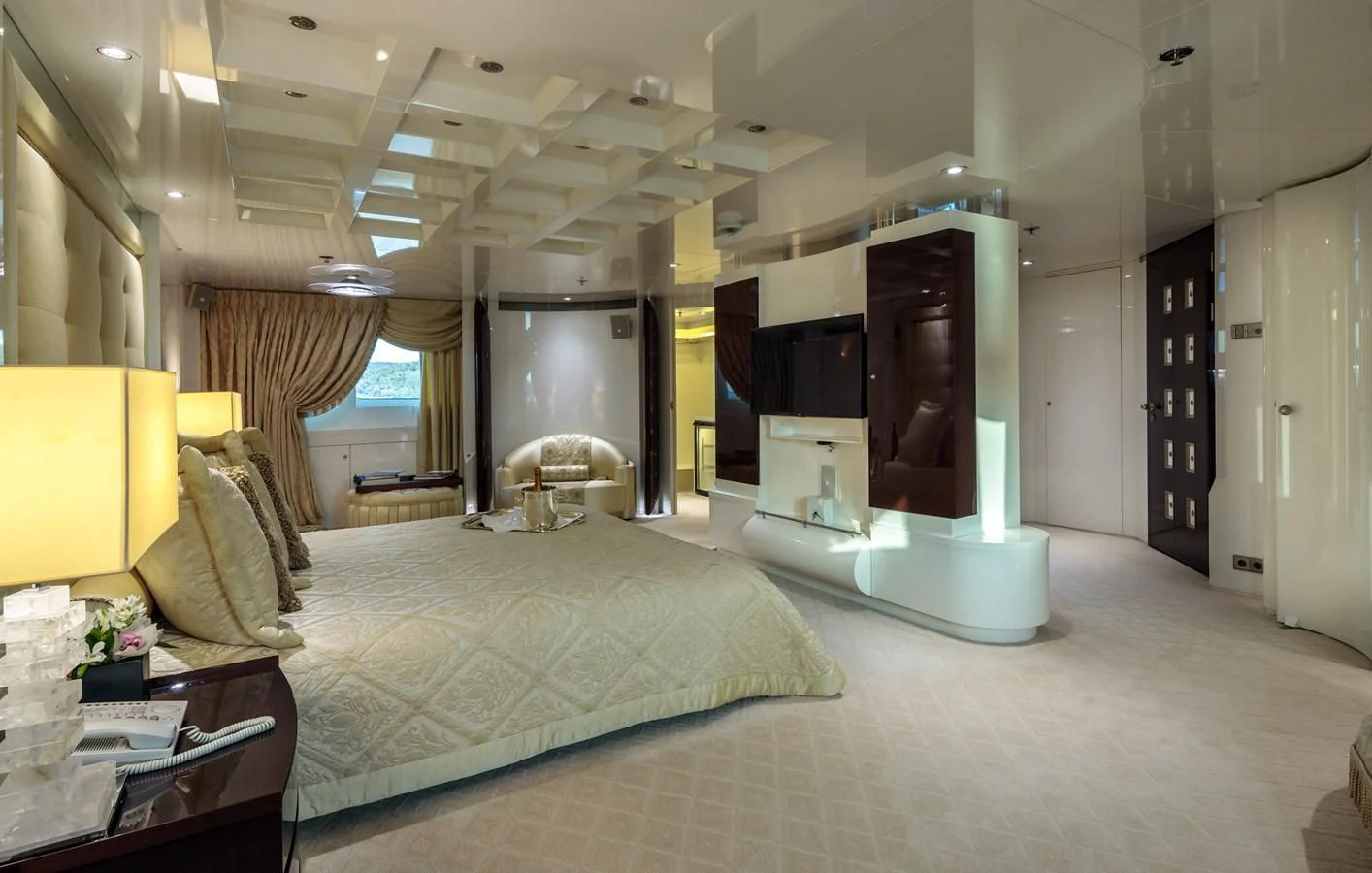 a hotel room with a bed and a tv aboard VERA Yacht for Sale