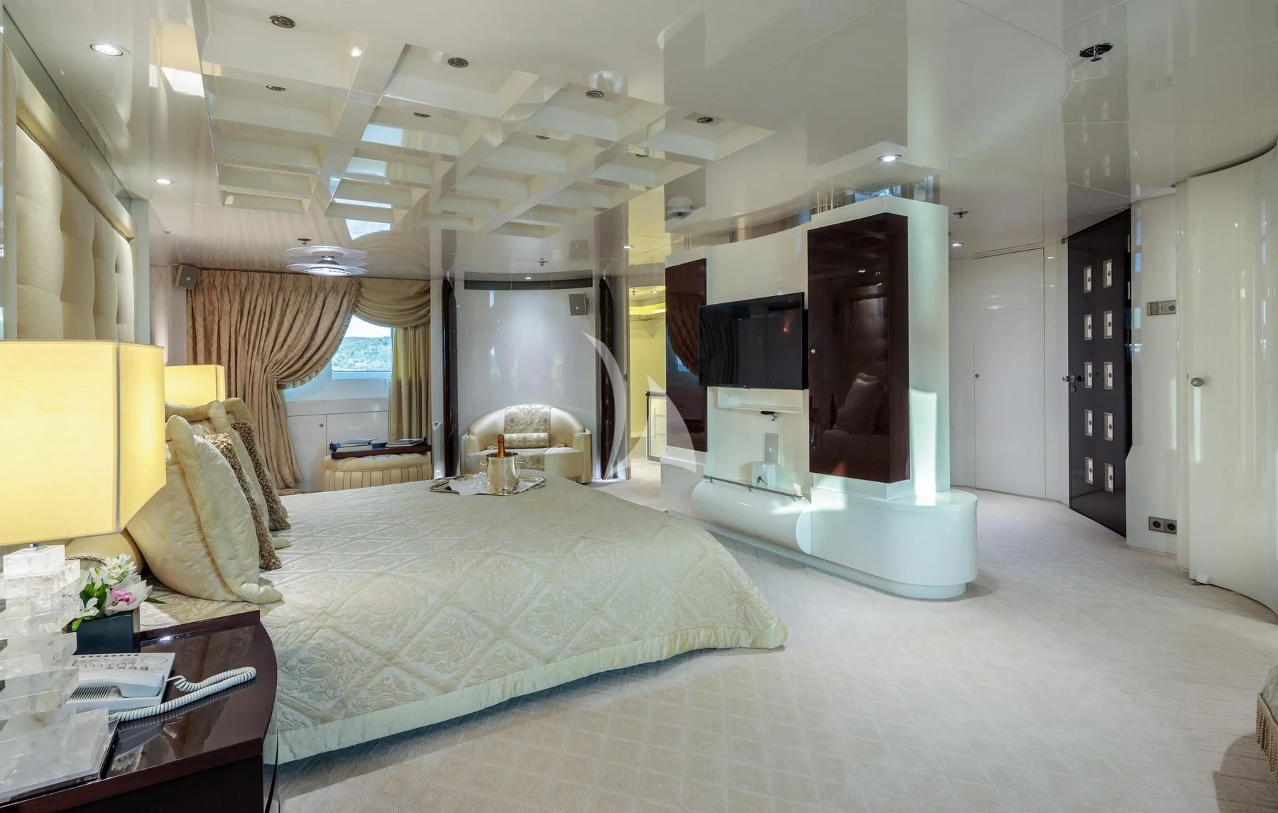 a bedroom with a bed and a tv aboard VERA Yacht for Sale