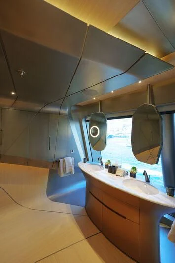 a bathroom with a large mirror aboard THIS IS IT I Yacht for Sale