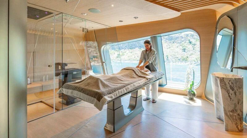 a person standing next to a bed aboard THIS IS IT I Yacht for Sale