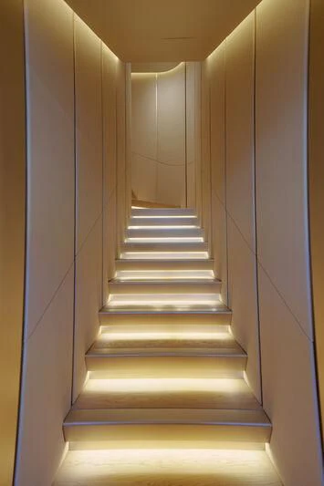 a staircase with a light on the side aboard THIS IS IT I Yacht for Sale