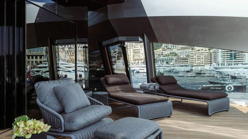 a living room with a large window aboard THIS IS IT I Yacht for Sale