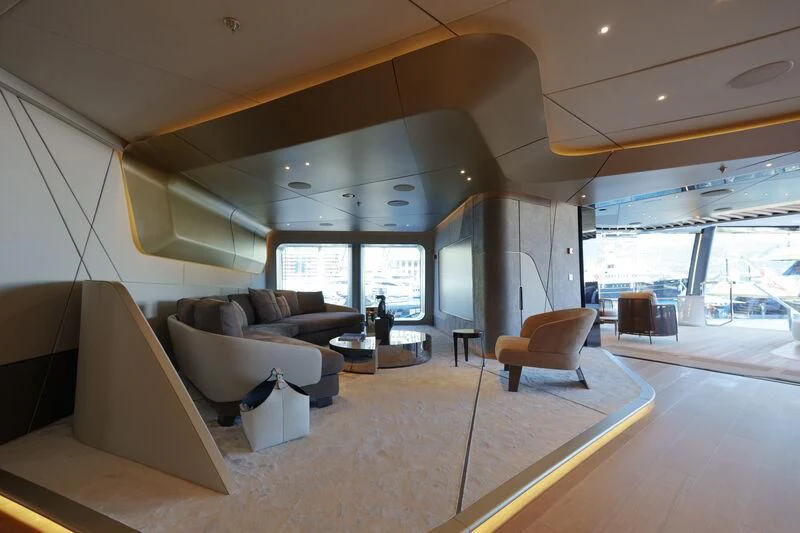 a living room with a large window aboard THIS IS IT I Yacht for Sale