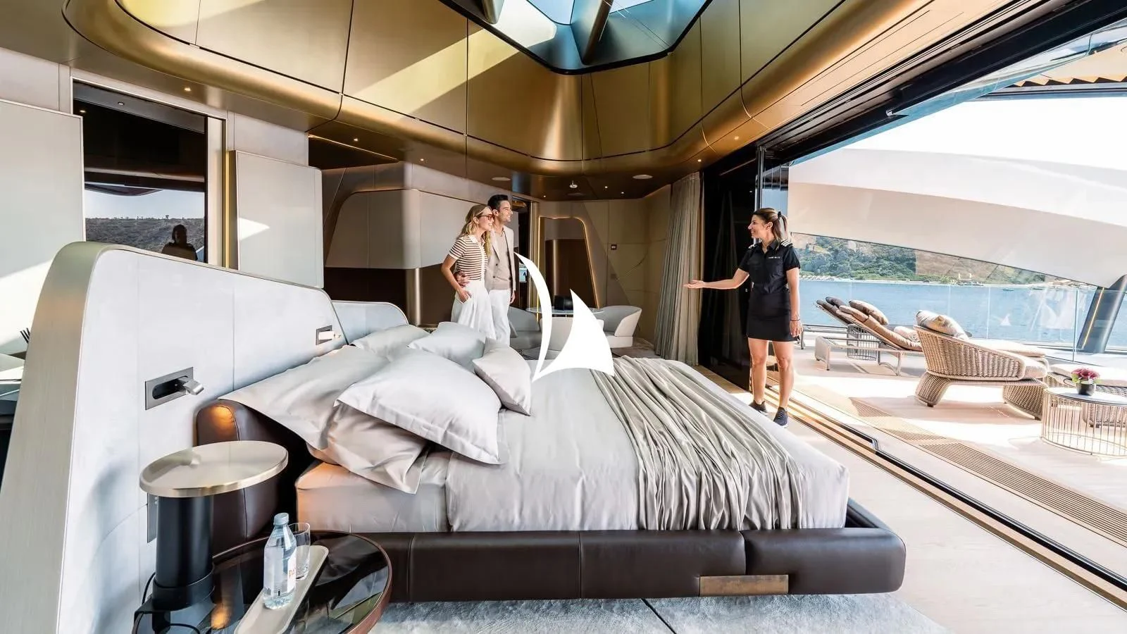 a couple of women standing next to a bed aboard THIS IS IT I Yacht for Sale