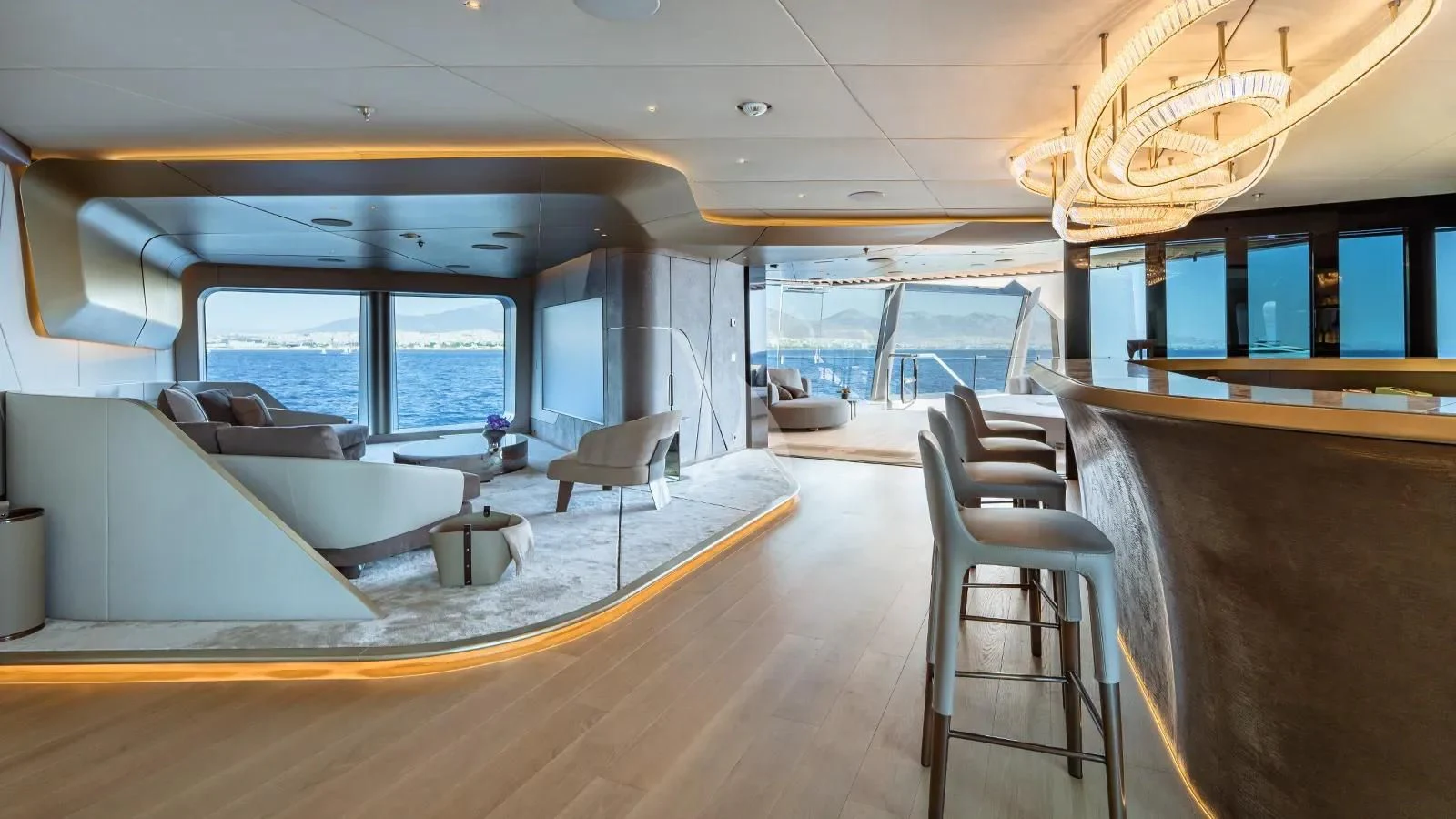 inside of a building with a large window and a table and chairs aboard THIS IS IT I Yacht for Sale