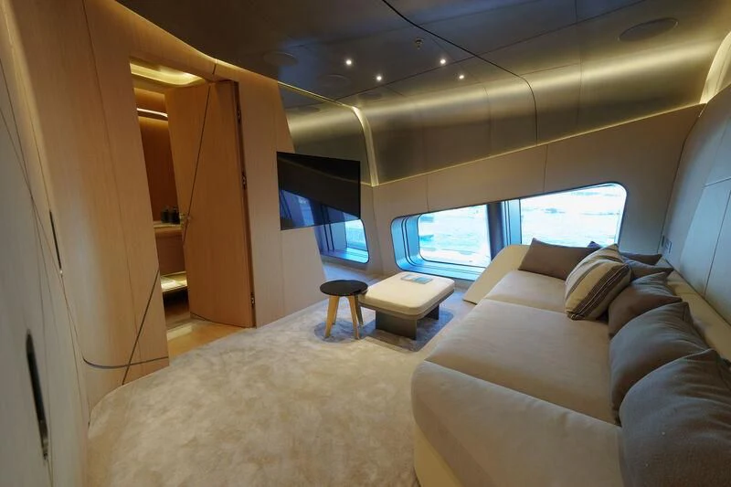 a room with a couch and a television aboard THIS IS IT I Yacht for Sale