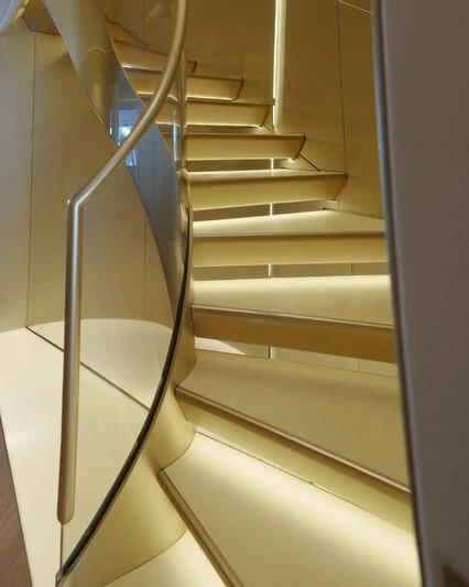 a white staircase with glass doors aboard THIS IS IT I Yacht for Sale