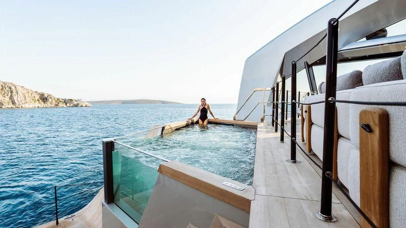 a person on a rope on a boat in the water aboard THIS IS IT I Yacht for Sale