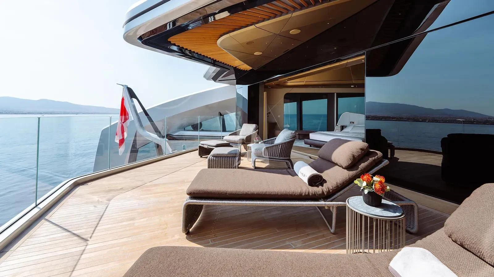 a large living room with a large balcony overlooking the ocean aboard THIS IS IT I Yacht for Sale