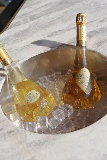 a group of bottles on a table aboard THIS IS IT I Yacht for Sale