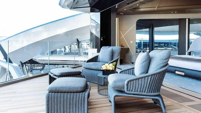 a room with a couch and a table aboard THIS IS IT I Yacht for Sale