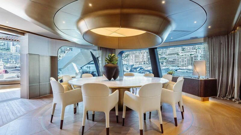 a room with a table and chairs aboard THIS IS IT I Yacht for Sale