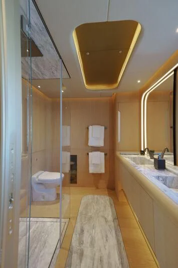 a bathroom with a large mirror aboard THIS IS IT I Yacht for Sale