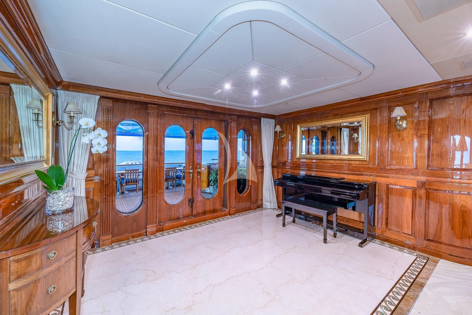 a large kitchen with wooden cabinets aboard AMORE Yacht for Charter