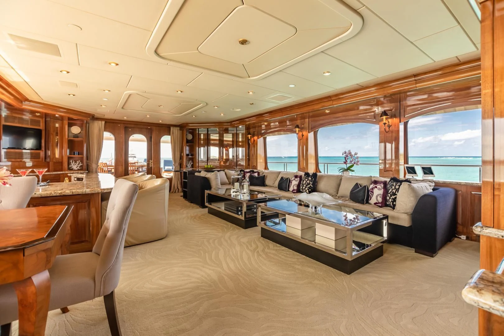 a living room with a large window aboard AMORE Yacht for Charter