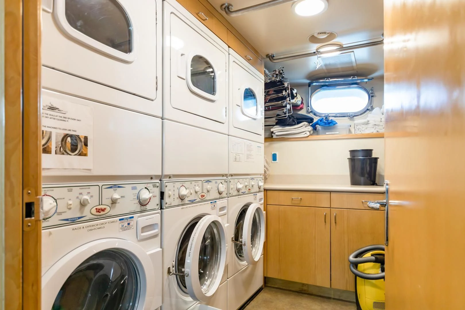 a laundry room with washing machines aboard AMORE Yacht for Charter