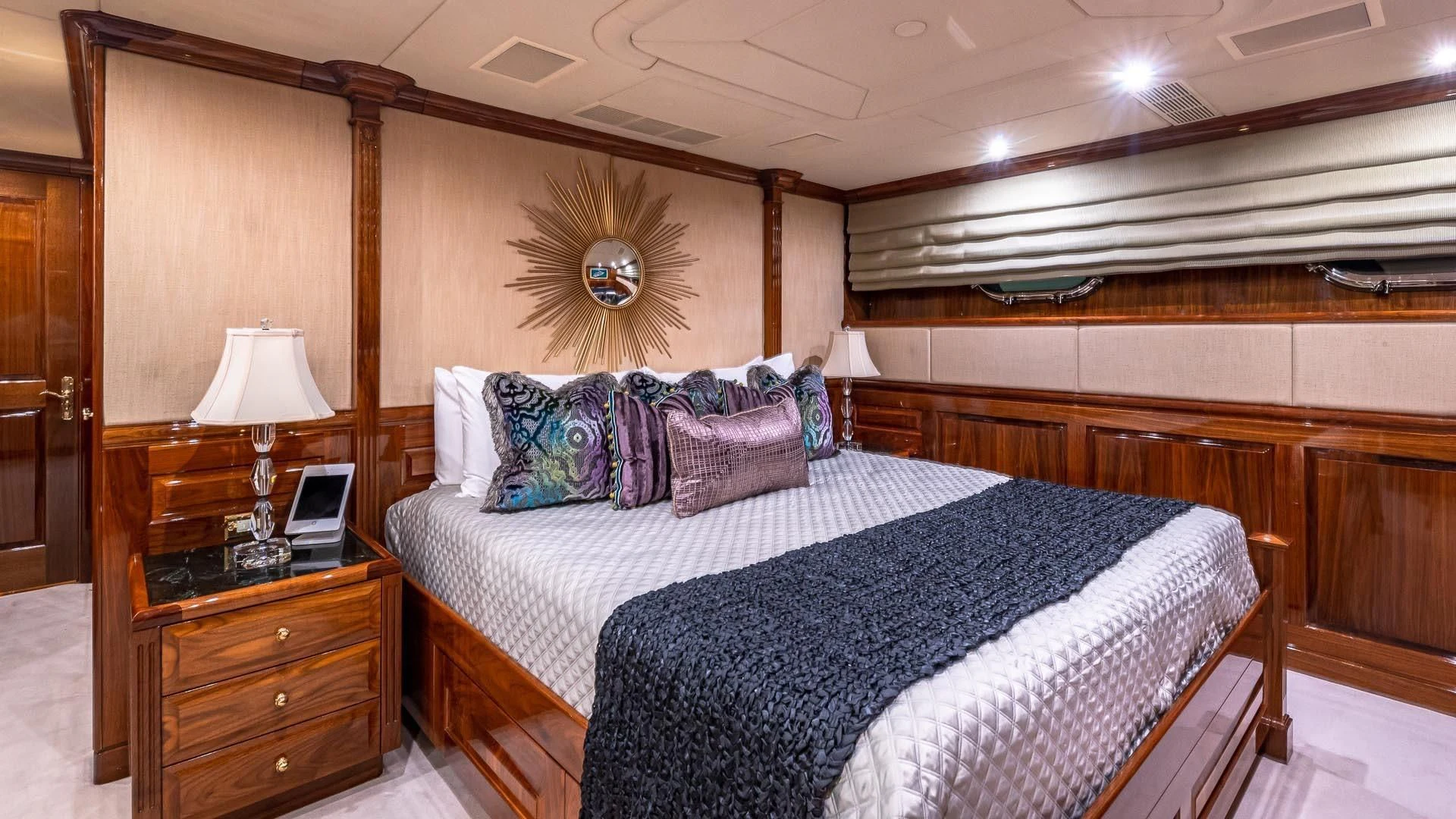 a bedroom with a bed and a desk aboard AMORE Yacht for Charter