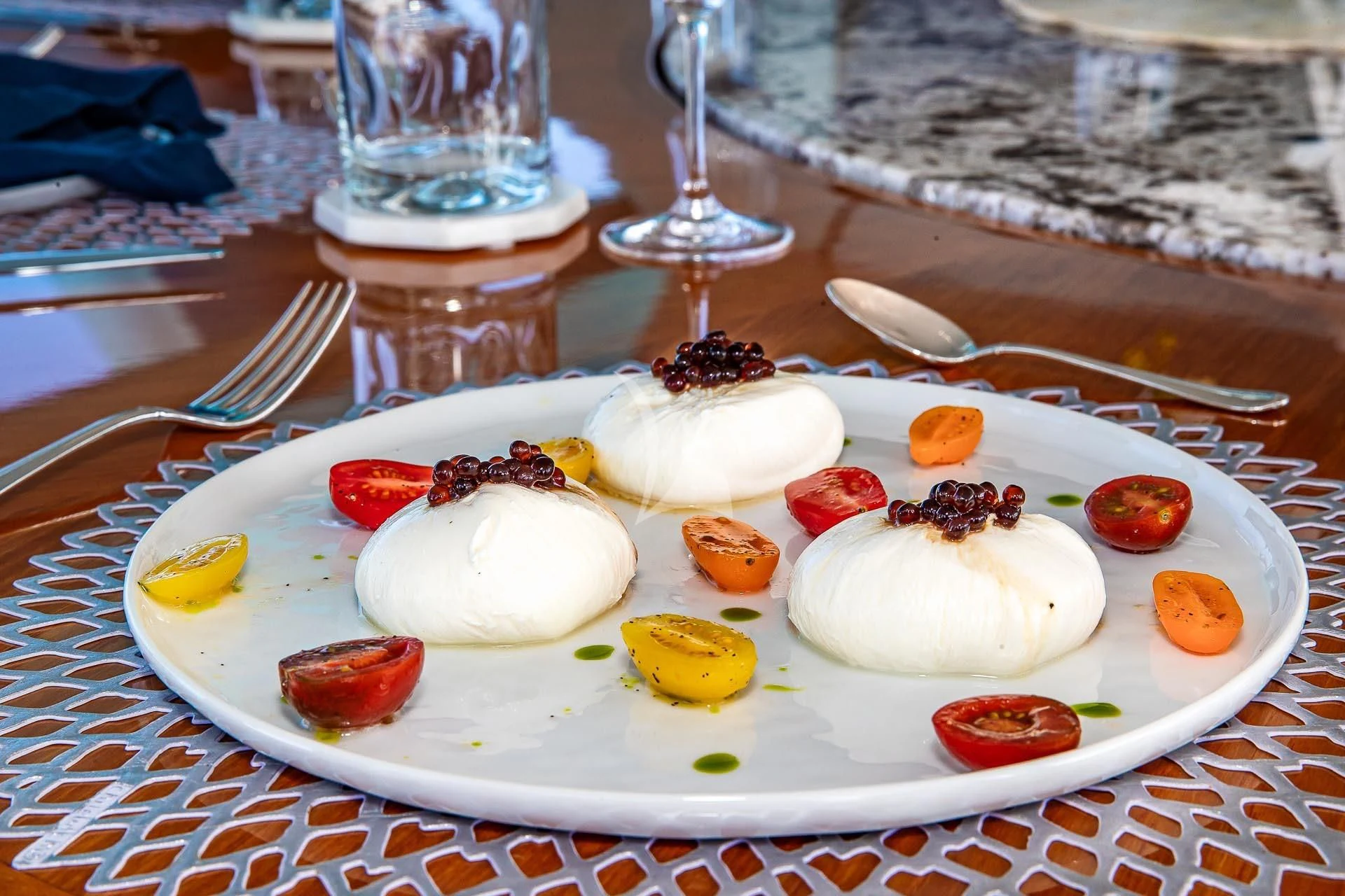 a plate of food aboard AMORE Yacht for Charter