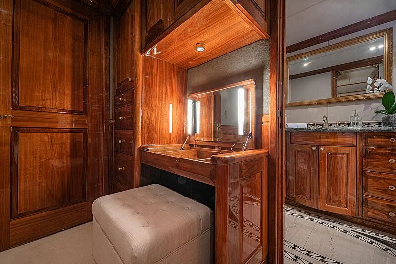 a bathroom with wooden cabinets aboard AMORE Yacht for Charter